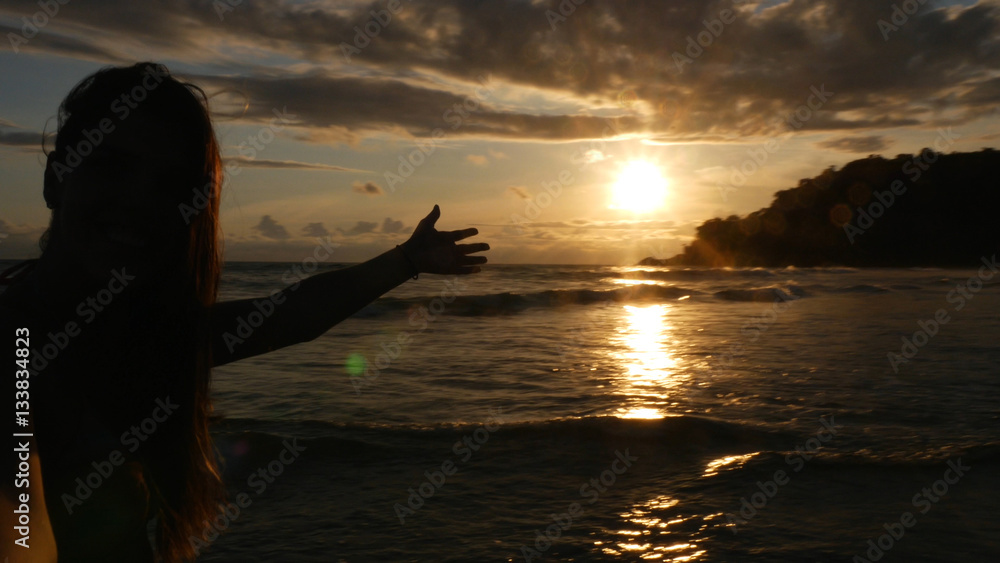 Brazilian Woman enjoying a sunset on the Beach