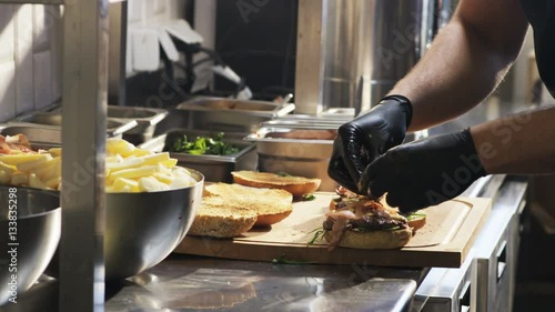 Adding Tomatoes to Burgers