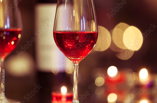 Closeup of wine glass in a restaurant setting. 