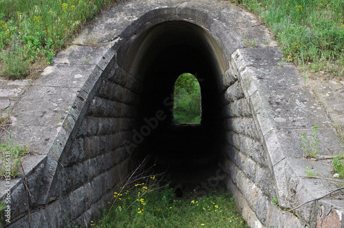  Old stone tunnel in dark with light
