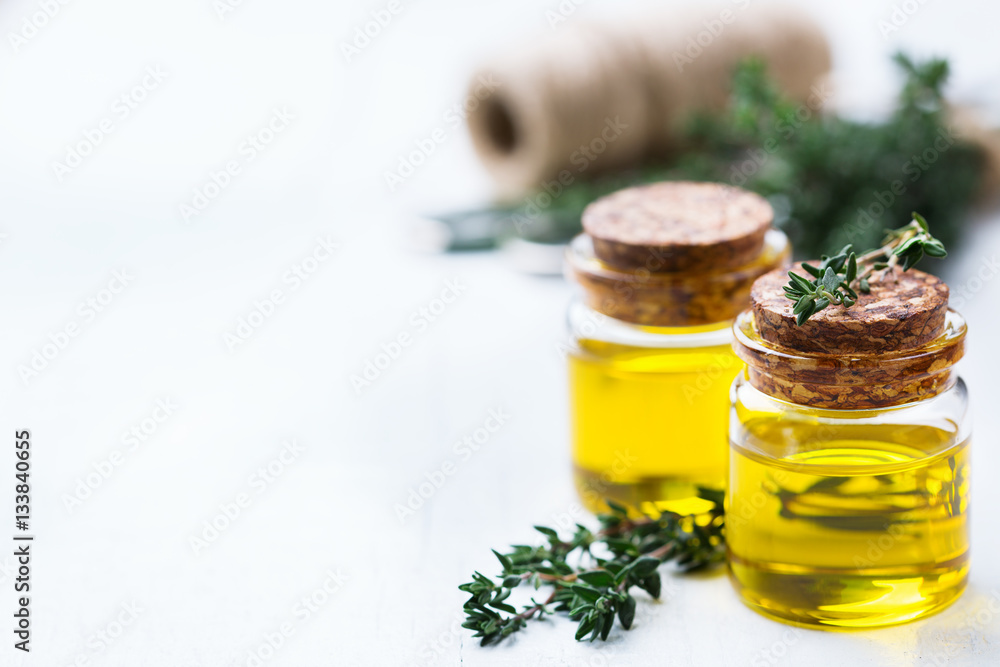 Organic essential thyme oil with green leaves Organic essential thyme oil with green leaves