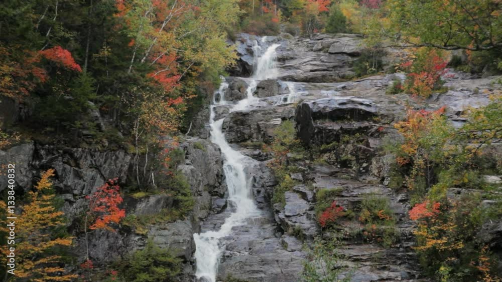 Locked down clip of Silver Cascade waterfall during Autumn, in Crawford Notch State Park, in the white mountains of New Hampshire.
