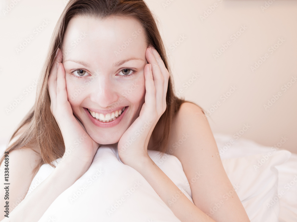 Fototapeta premium Beautiful smiling girl in bed. 