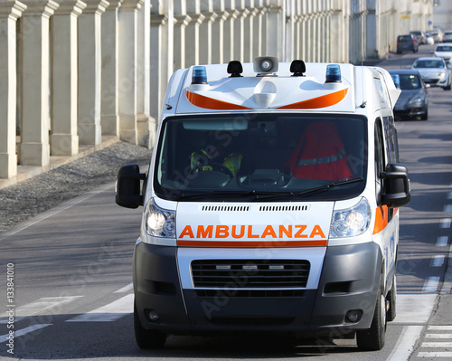 Italian Ambulance runs to the city street