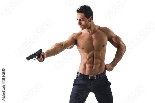 Half body Shot of a Handsome Athletic Man with no Shirt Holding a Handgun While Looking to the Left of the Frame. Isolated on White Background.