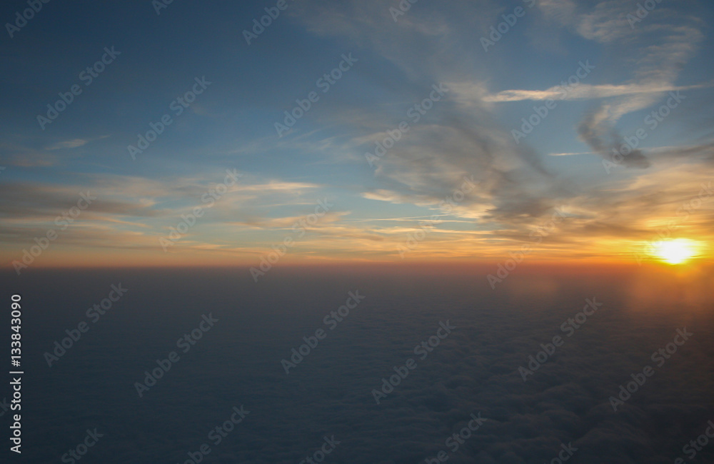 Fototapeta premium blue sky with white fluffy clouds and morning from airplane for
