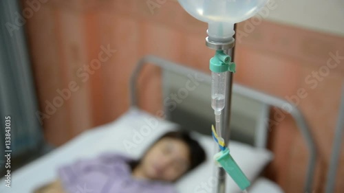 Close up of a woman patient in hospital with saline intravenous 