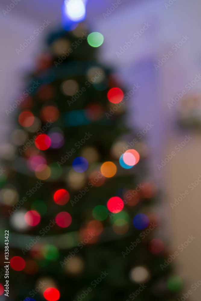 blurry bokeh light from Christmas tree and fire place for backgr blurry bokeh light from Christmas tree and fire place for backgr