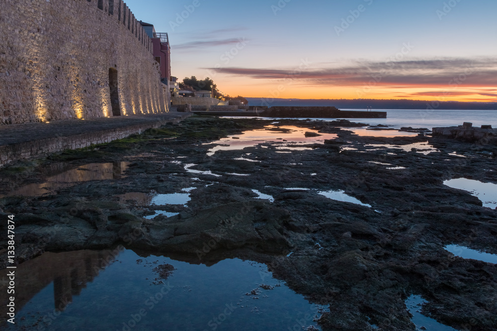 Fototapeta premium Morning by the sea by the city wall in Novigrad, Croatia