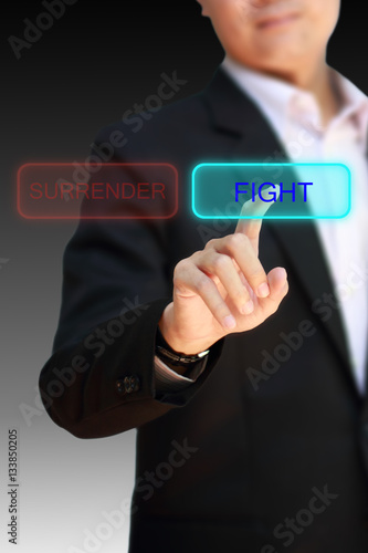 Business man finger pointing to choose FIGHT.