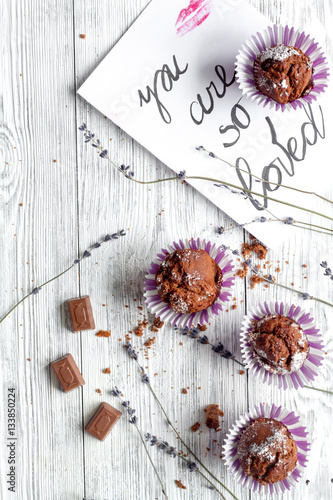 concept of Valentine's Day cupcakes wooden background top view