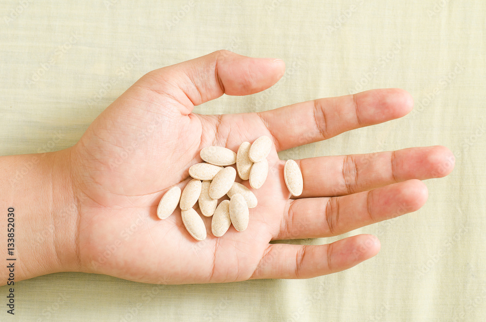 Medicine herb in hand,Alternative Medicine,Herbal supplement pill