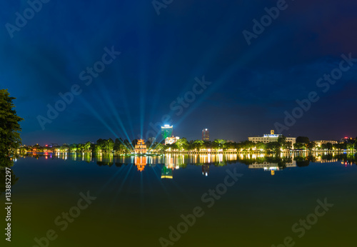 Hoan Kiem lake panorama view at sunset period with ancient Turtle Tower and Hanoi post office (Buu Dien Ha Noi in Vietnamese) . Hoan Kiem lake (Sword lake or Ho Guom) is center of Hanoi