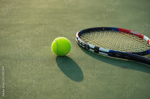 Tennis ball and racket under late evening sunlight © Hanoi Photography