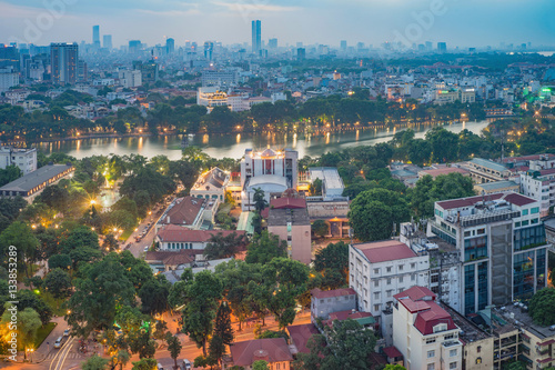 Aerial view of a Hoan Kiem lake   Sword lake  Ho Guom in Vietnamese   at night. Hanoi skyline view. Hoan Kiem lake is center of Hanoi