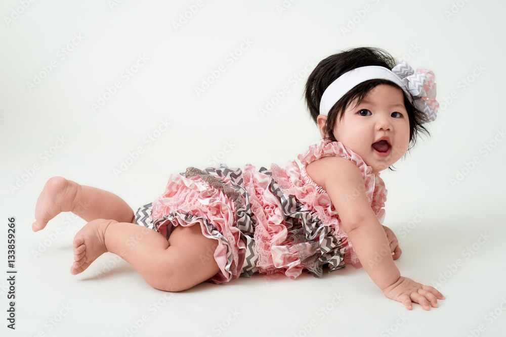 baby girl with cute floral dress and white background baby girl with cute floral dress and white background