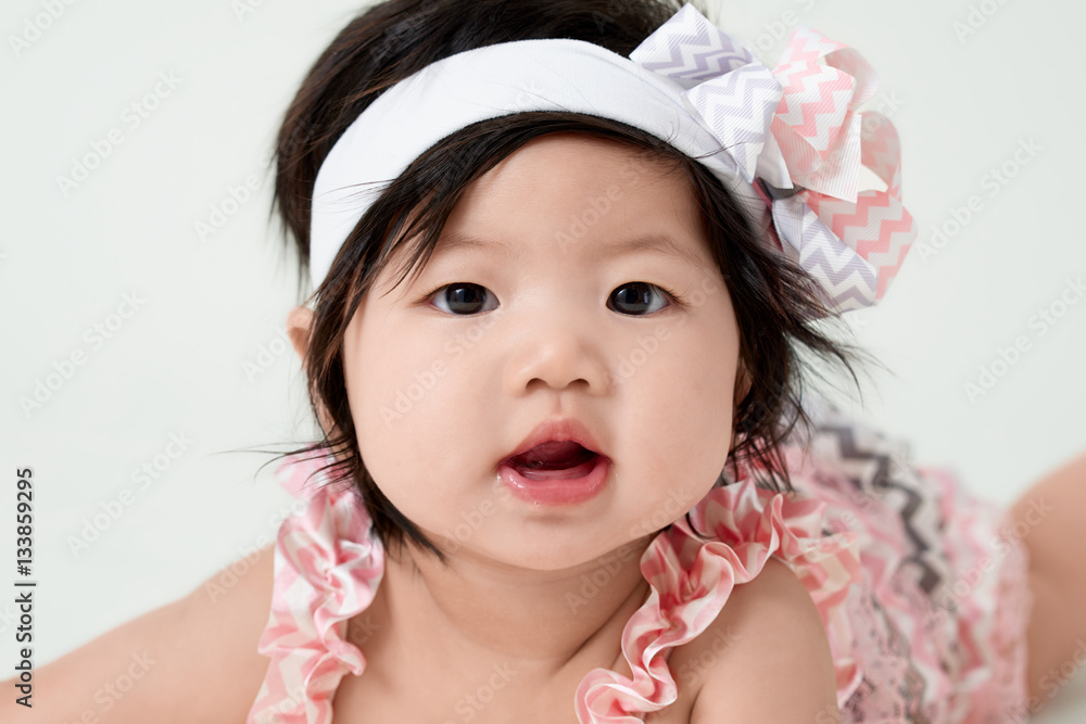 baby girl with cute floral dress and white background baby girl with cute floral dress and white background