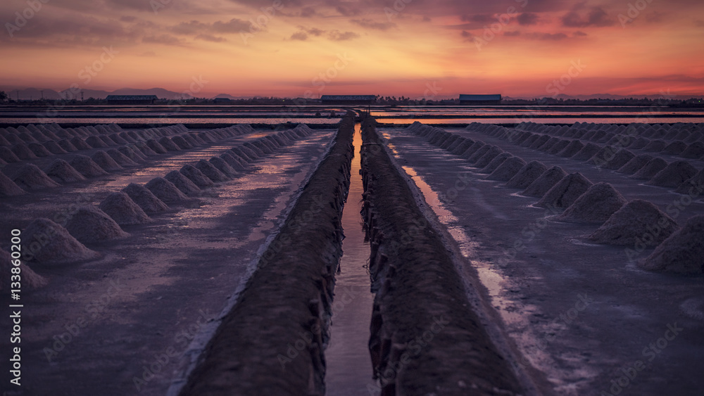 Fototapeta premium Salt fields in thailand in sunset