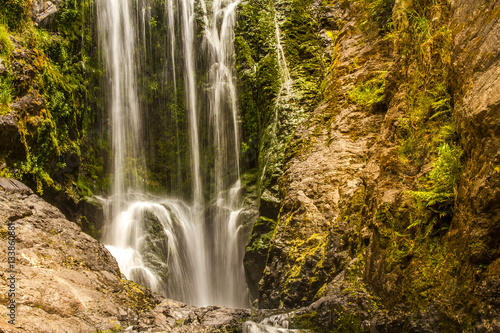 beautiful water fall in forest, new zealand, waipu, piroa falls