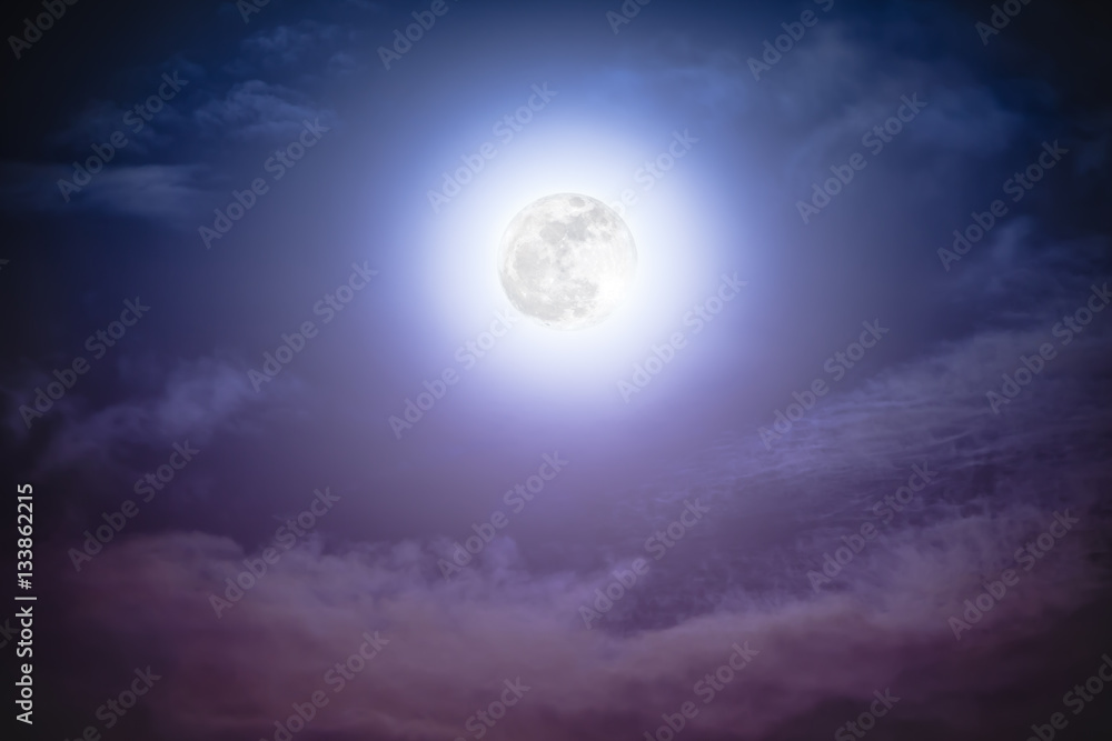 Fototapeta premium Nighttime sky with clouds and bright full moon with shiny.