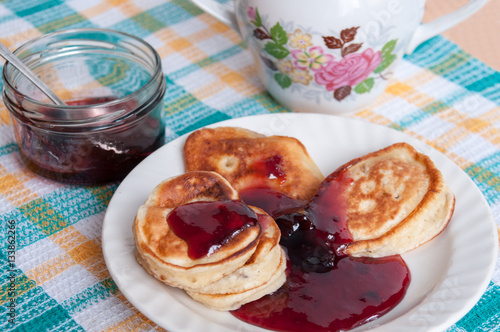 Delicious pancakes for breakfast with cherry jam