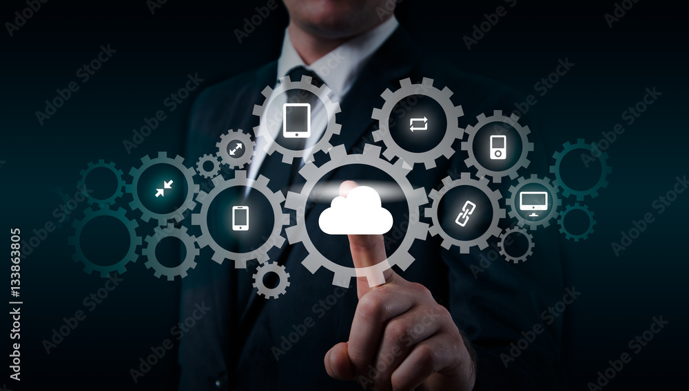 Businessman holding a cloud connected to many objects on virtual screen concept about the internet of things Businessman holding a cloud connected to many objects on virtual screen concept about the internet of things