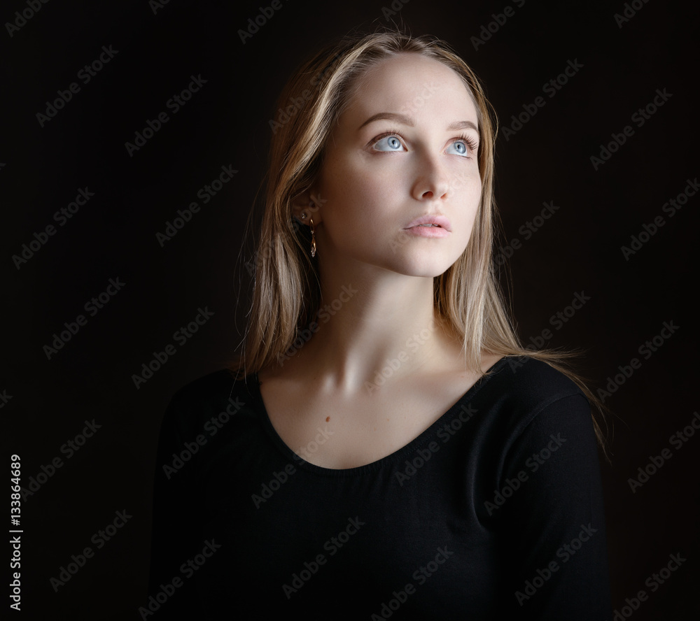 Portrait of a beautiful young woman with blue eyes. Portrait of a beautiful young woman with blue eyes.