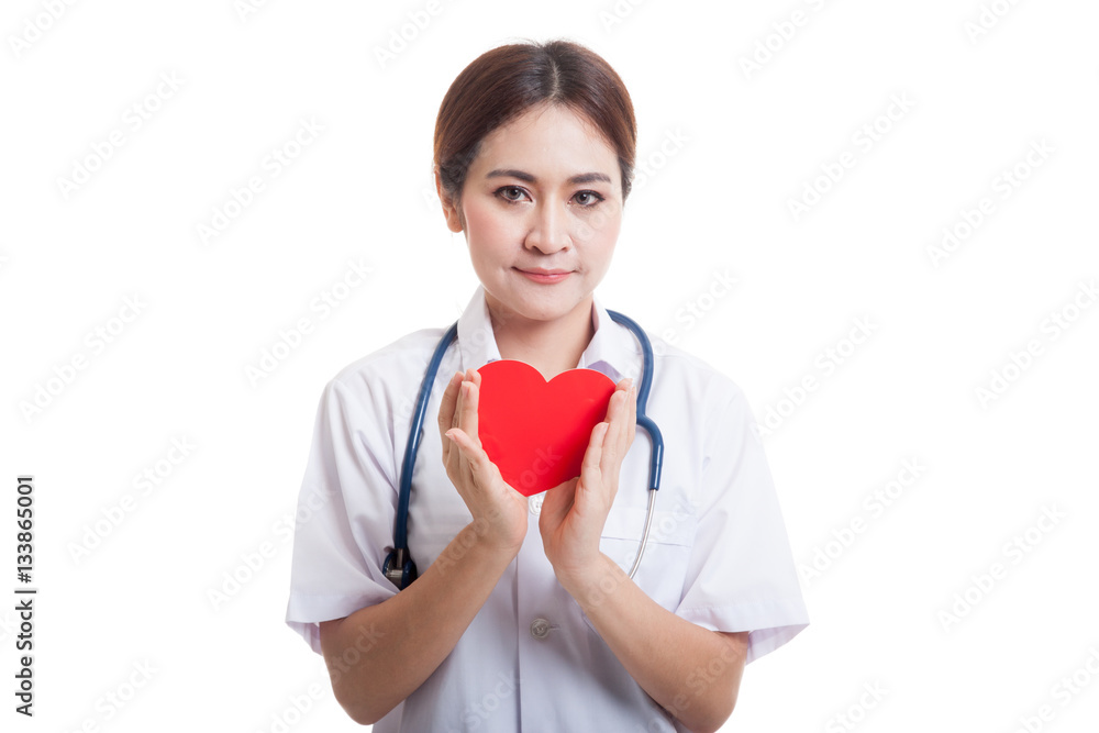 Asian young female doctor hold a red heart. Asian young female doctor hold a red heart.
