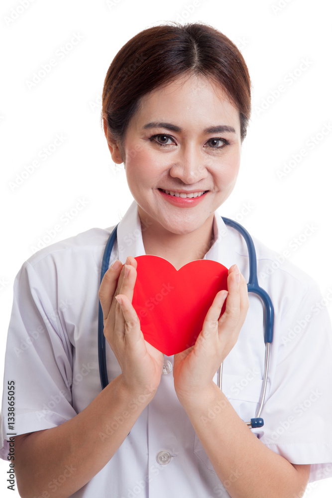 Asian young female doctor hold a red heart and smile. Asian young female doctor hold a red heart and smile.