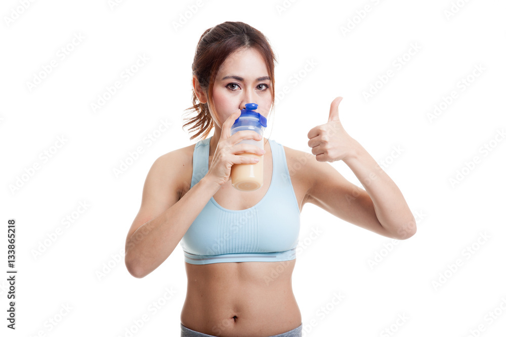 Beautiful Asian healthy girl show thumbs up drink whey protein. Beautiful Asian healthy girl show thumbs up drink whey protein.