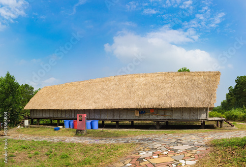 Typical house of M'nong people in central high land of Vietnam photo