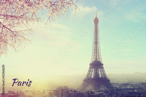 Welcome to Paris! Aerial view of Paris cityscape with Eiffel tower at sunset. Vintage colored picture Love and travel concept