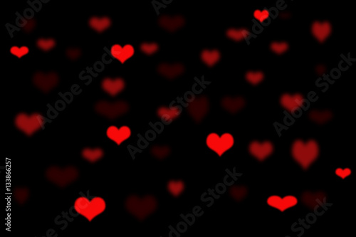 red heart bokeh on black blackground