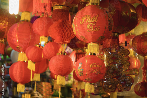Asian red lantern. The printed word on lantern means  happy  and  prosperous 