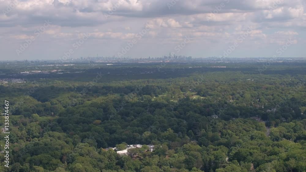 AERIAL: Flying above the luxury suburbs towards the famous New York City skyline AERIAL: Flying above the luxury suburbs towards the famous New York City skyline