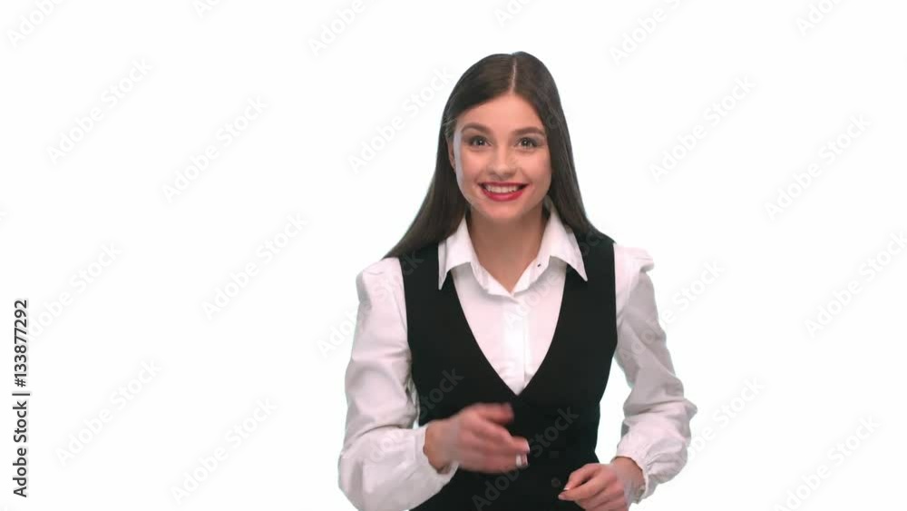 Girl in business clothes, eavesdropping on a white background Girl in business clothes, eavesdropping on a white background