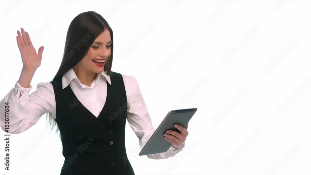 Using skype. Young pretty woman holding tablet computer Using skype. Young pretty woman holding tablet computer