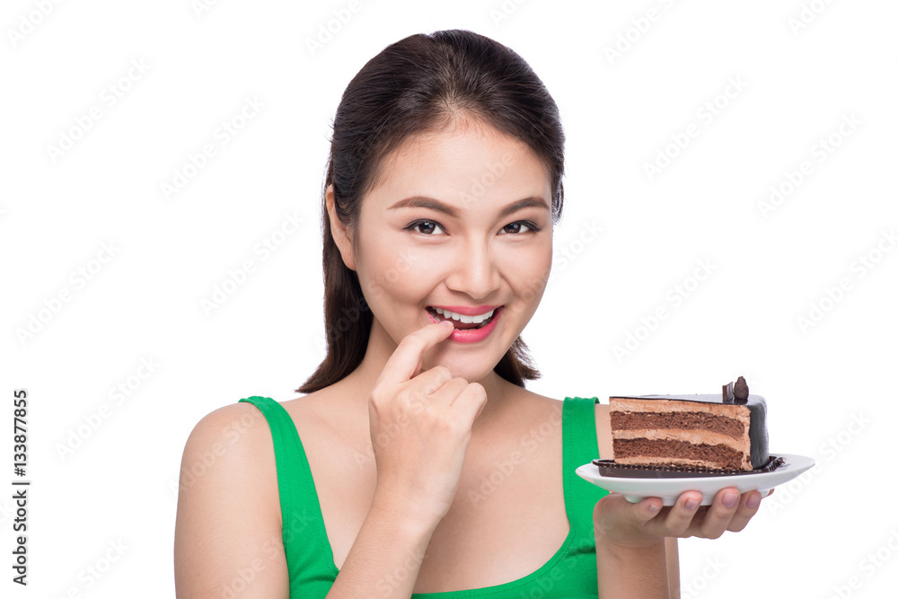 Beautiful smiling asian young woman with a chocolate cake isolat Beautiful smiling asian young woman with a chocolate cake isolat