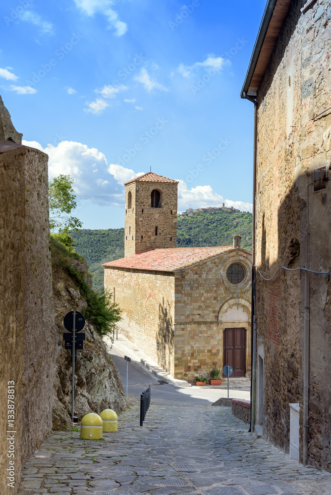  alley and historic church in the tuscan village, Buriano, italy