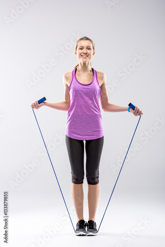 Woman exercising with skipping rope