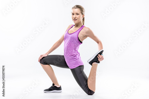 Sporty woman stretching © LIGHTFIELD STUDIOS