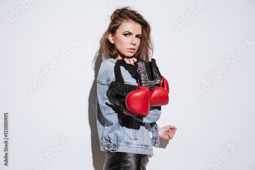 Gorgeous lady boxer isolated over white background