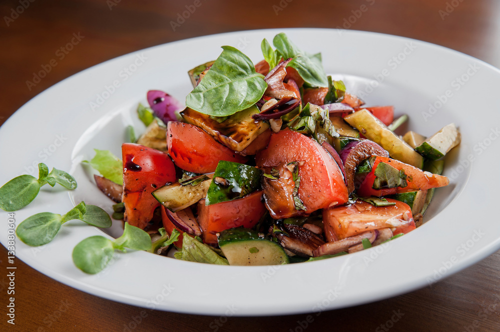 salad with tomato, zucchini and balsamic sauce, onions and herbs salad with tomato, zucchini and balsamic sauce, onions and herbs