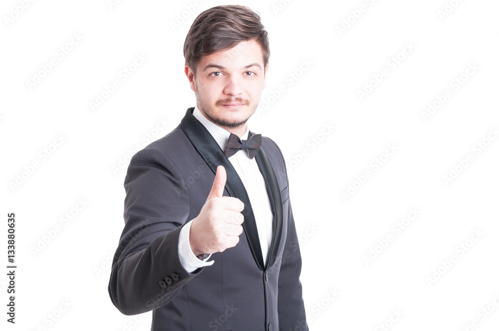 Handsome man wearing tuxedo and bowtie showing like Handsome man wearing tuxedo and bowtie showing like
