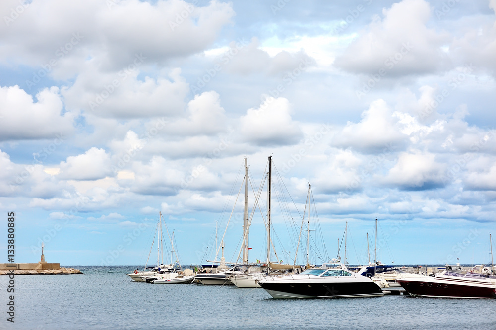 Boats in a summer cloudy day in the port of Ostuni, Apulia, Italy