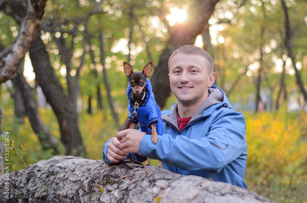 The guy with the dog in the park The guy with the dog in the park