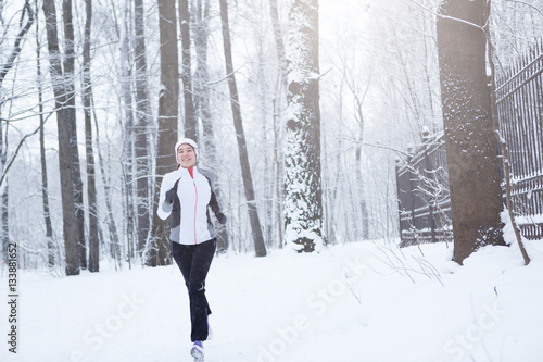 Photo of young brunette running