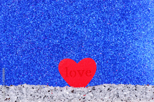 The red heart shapes on abstract light blue glitter background in love concept for valentines day and romantic moment