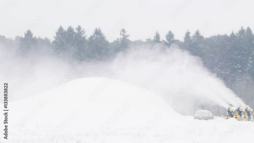 snow gun making hill outdoors in winter snow gun making hill outdoors in winter