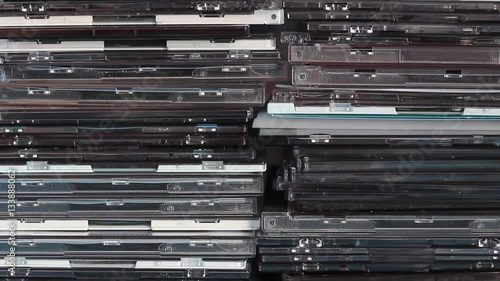 Empty and used DVD/CD boxes in the drawer. Background type of use.